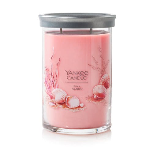 A pink Yankee Candle tumbler labeled “Pink Sands,” with two wicks and brushed tin lid.