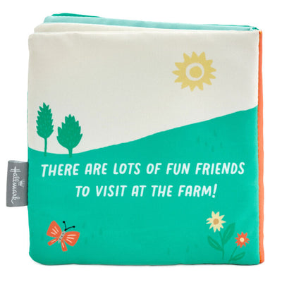 Farm-themed touch-and-feel baby book with soft fabric pages featuring baby duck, pig, horse, and cow illustrations.