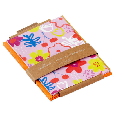 Mauve mini cards with colorful abstract floral designs and gold foil accents, paired with matching envelopes.
