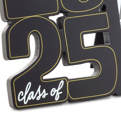 Black wood graduation photo frame with sculpted metallic gold "2025" numbers, white script lettering, and a 4x6 vertical photo opening for a grad's picture.

