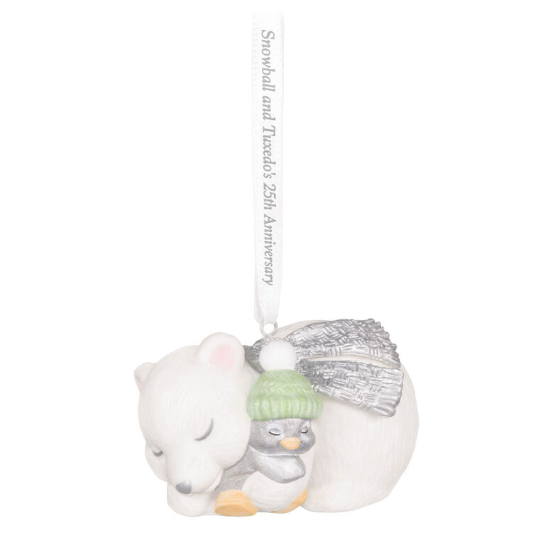 Hallmark Keepsake ornament of Snowball the polar bear cuddling Tuxedo the penguin, white and silver design celebrating 25th anniversary.