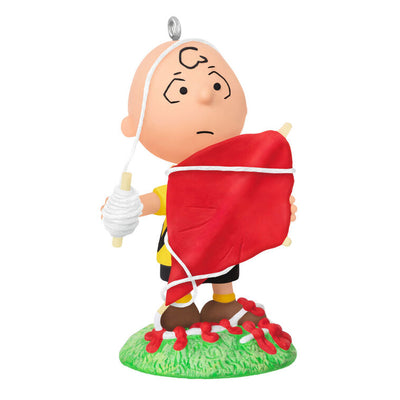 Mini Charlie Brown ornament tangled in red kite string, celebrating 75th anniversary, Hallmark Peanuts Christmas collectible