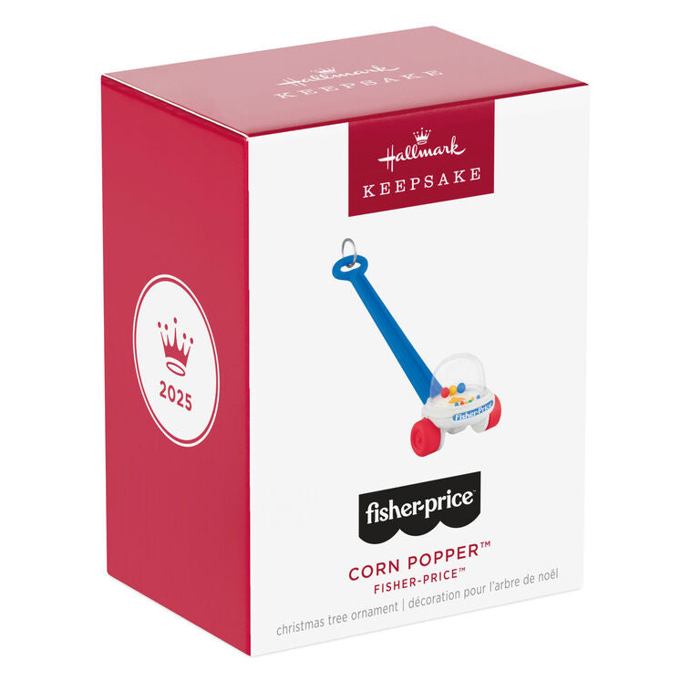 Mini Corn Popper ornament with red wheels, blue handle, and clear dome filled with colorful popping balls.

