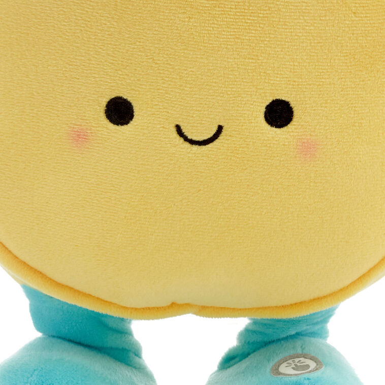 Round yellow smiley face plush toy with blue arms and legs, dancing and singing &