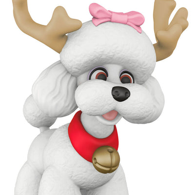 White poodle Christmas ornament wearing reindeer antlers and jingle bell collar, festive holiday decoration

