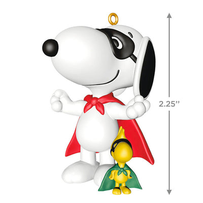 Hallmark Keepsake Peanuts ornament of Snoopy and Woodstock wearing superhero capes and masks, posed as festive holiday heroes.