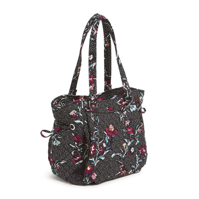 Black floral patterned Glenna Satchel with multiple exterior and interior pockets and adjustable drawstring
