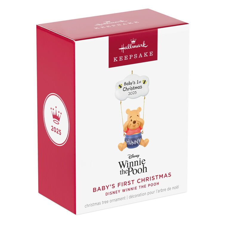 Winnie the Pooh Christmas ornament swinging under a "Baby’s 1st Christmas 2025" cloud with hunny pot and bee accents