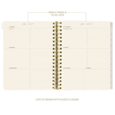 Graphique 6 x 8 hardbound spiral planner with playful cover, elastic band, laminated tabs, and gold foil stickers.

