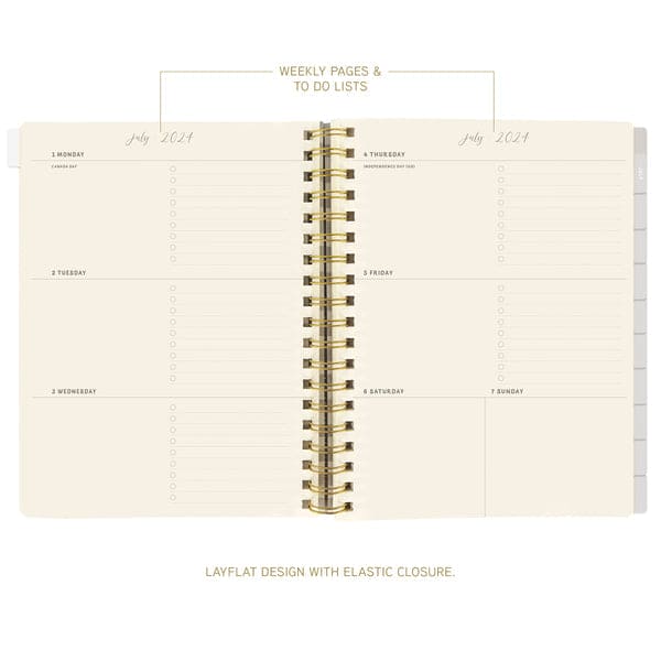 Graphique 6 x 8 hardbound spiral planner with playful cover, elastic band, laminated tabs, and gold foil stickers.

