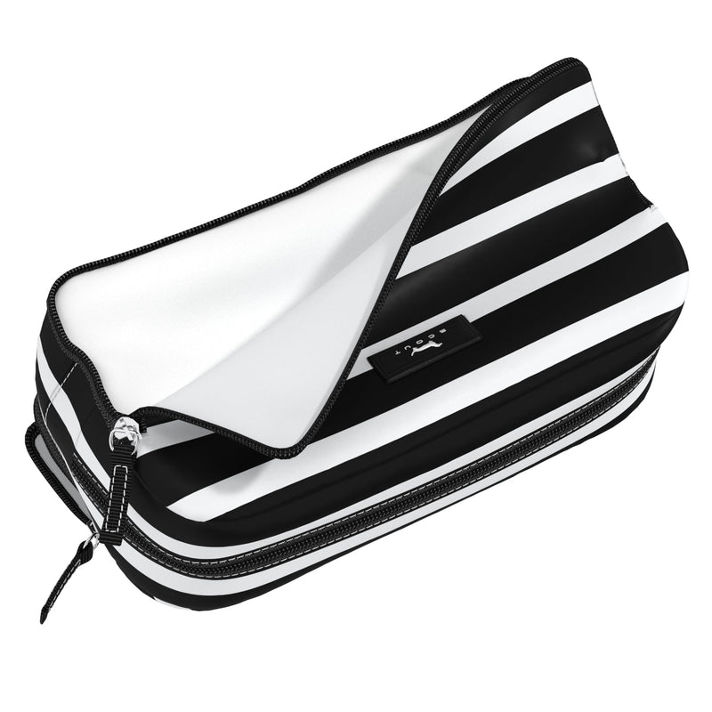 Late Bloomer 3-Zip toiletry bag with three compartments for organizing toiletries, makeup, or school supplies; stands upright.