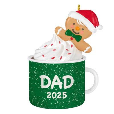 2025 Christmas ornament of gingerbread dad cookie in green mug with whipped cream, festive holiday design


