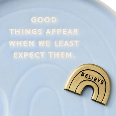 Hallmark rainbow-shaped blue ceramic trinket dish with “Believe” metal token and inspirational quote.