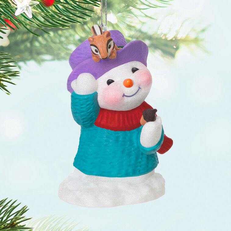 Snowman in blue sweater and red scarf, holding acorn with chipmunk on purple hat, Hallmark Keepsake Snow Buddies 2025 ornament
