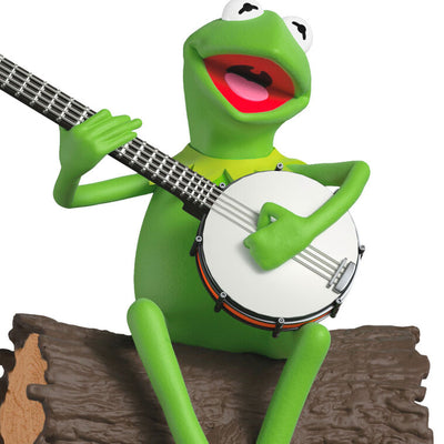 Kermit the Frog sitting on a log with a banjo, from The Muppets, musical Christmas ornament with motion.

