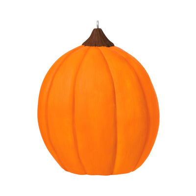 Halloween ornament with jack-o'-lantern and friendly devil holding pitchfork against red flame backdrop