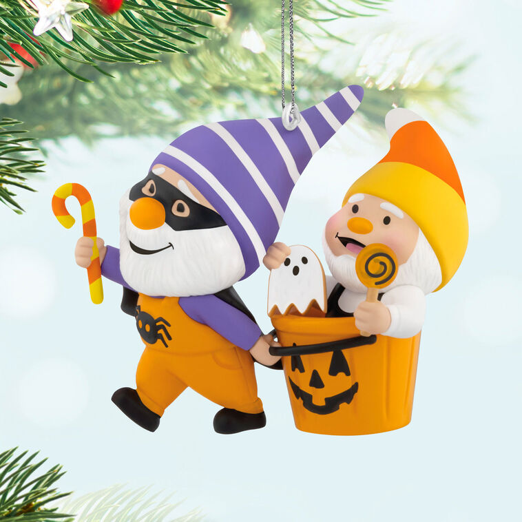 Halloween ornament of two gnomes, one dressed as bat and one with candy corn hat in jack-o&