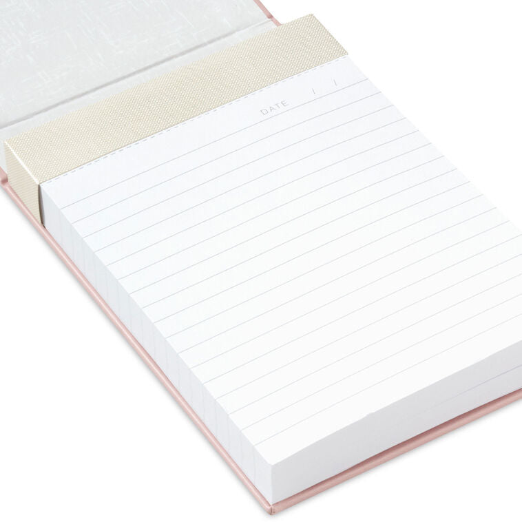Pastel pink faux leather list pad with gold foil honeycomb design and lined, perforated pages.
