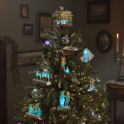 Disney Haunted Mansion tree topper with synchronized light and sound show, remote control activation, and glowing Disney