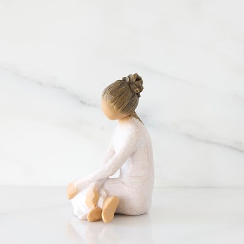 Willow Tree Serenity figurine, seated woman in cream dress with arms crossed in a calm, reflective pose.