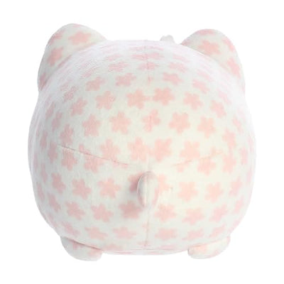 A spring collection plush cat with a pink body and a cherry blossom flower.