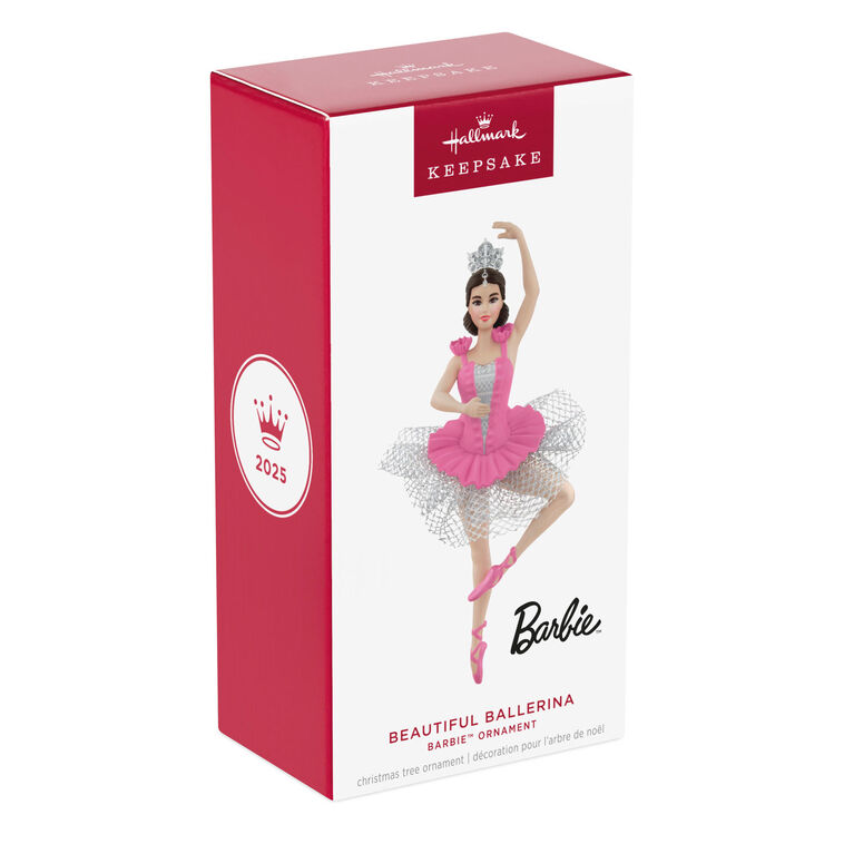 Barbie ballerina Christmas ornament wearing a pink tutu, pointe shoes, and silver tiara, posed en pointe with arm raised in a graceful ballet position.