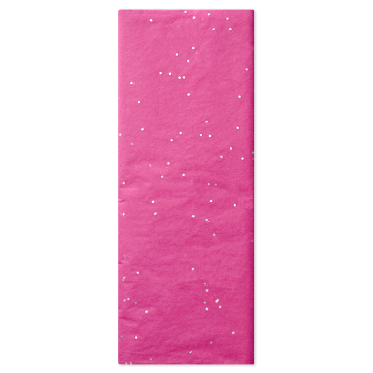 Hot pink Hallmark tissue paper with shimmering iridescent dots, displayed folded and fluffed in a gift bag.