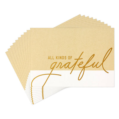 Tan and cream thank-you cards with gold foil script reading “all kinds of grateful” on two-tone background.
