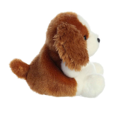 Brown and white plush dog with floppy ears and stitched facial features