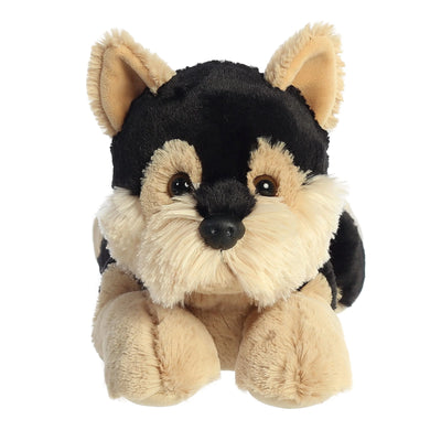 Black and tan plush dog with floppy ears laying down