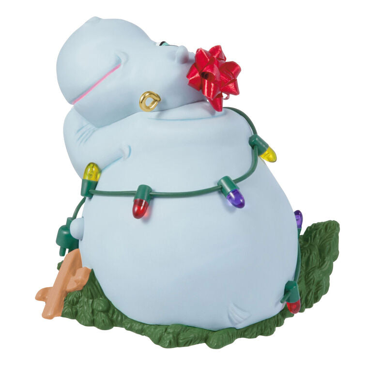Hippopotamus Christmas ornament tangled in lights on a squished tree, plays holiday song, battery operated

