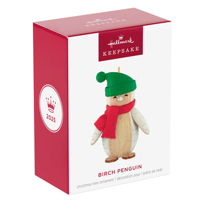 Penguin Christmas ornament styled like birch wood, wearing red scarf and green stocking hat
