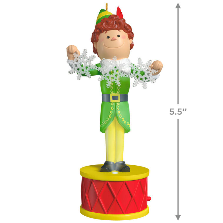 Buddy the Elf ornament with light and sound, standing on red base in green costume with snowflakes, inspired by the movie “Elf”