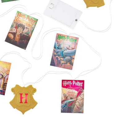 7-foot Harry Potter string lights with sculpted books and Hogwarts crests, white LED glow and clear wire.

