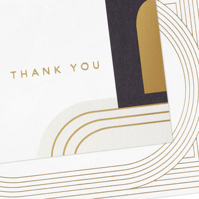 Assorted thank-you cards with modern gold foil ovals and abstract black and ivory shapes on white.
