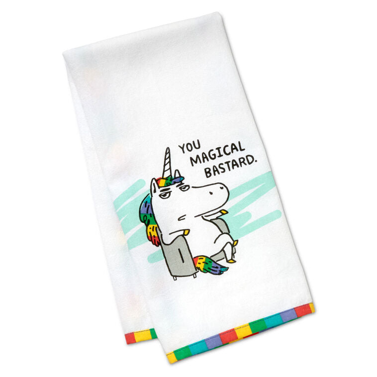 White cotton tea towel with rainbow-striped border and unicorn in chair, featuring the message: “You magical bastard.”
