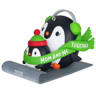 2025 Christmas ornament of mom and child penguins sledding together, green scarf with sweet message, festive holiday decor

