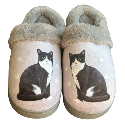 Black and white cat-themed slippers with plush lining and non-slip soles.