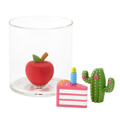 Clear plastic drinking glass with a center post for holding silicone charms; holds 15.5 oz and is dishwasher safe.