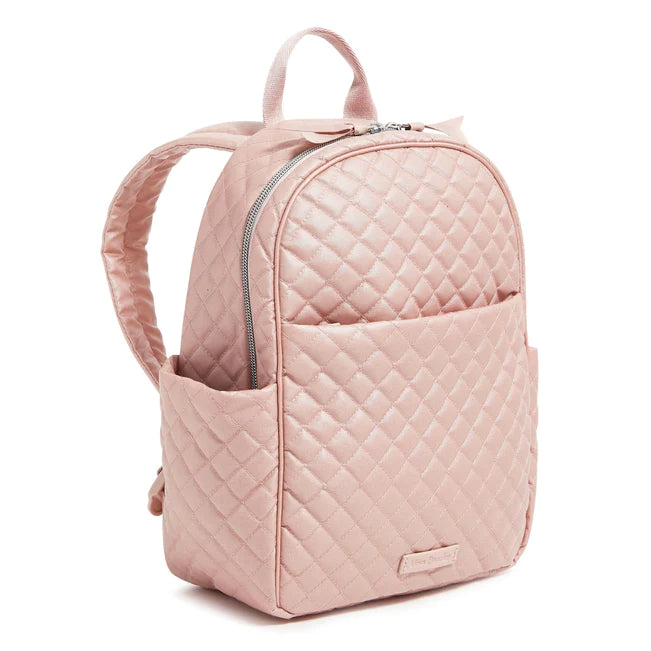 Rose Quartz Vera Bradley small backpack with two slip pockets, zip pockets, zip closure, and adjustable straps