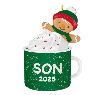 2025 Christmas ornament of gingerbread son cookie in green mug with whipped cream, festive holiday design

