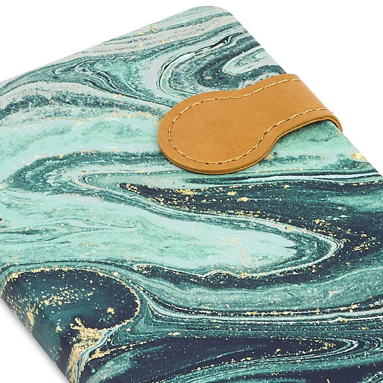 Slim hardcover journal with swirling blue and green marbled cover, gold foil details, and magnetic clasp.
