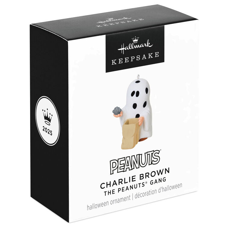 Miniature Charlie Brown Halloween ornament dressed as ghost holding rock from Peanuts Gang