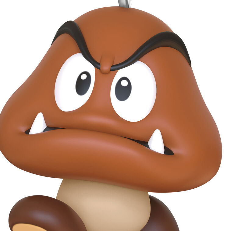 Hallmark Keepsake Mini Nintendo Super Mario Goomba ornament—brown mushroom-like enemy with sharp teeth, large eyes, oval feet, and angry eyebrows
