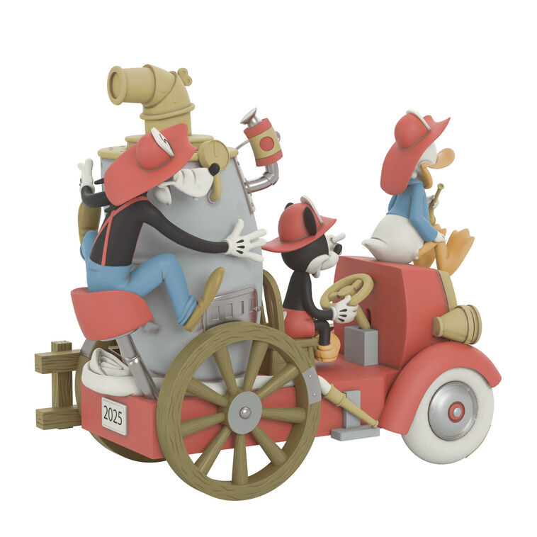 Mickey, Donald, and Goofy on a vintage fire engine ornament with light, sound, and motion from Mickey’s Fire Brigade.


