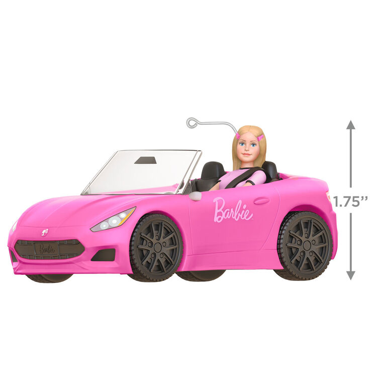Barbie ornament driving a pink convertible sports car, wearing pink tee and barrettes, Hallmark Keepsake holiday decoration.