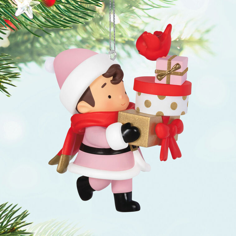Mystery ornament featuring Young Santa in festive outfit holding presents and a bird, blind-boxed surprise