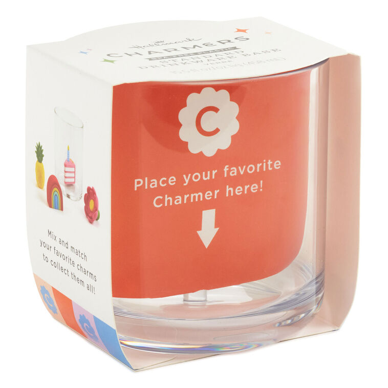 Clear plastic drinking glass with a center post for holding silicone charms; holds 15.5 oz and is dishwasher safe.