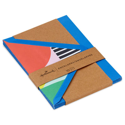 Bold royal blue envelopes with abstract multicolor shapes inside the flap and pointed flap design.
