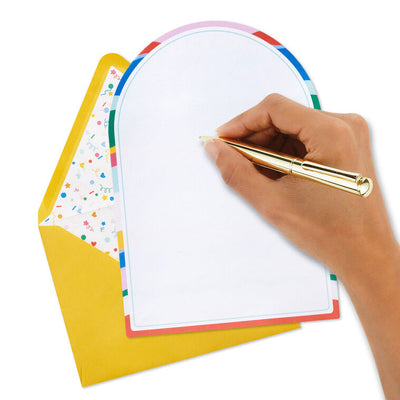 Stationery set with arched sheets in colorful wave and coral prints, yellow envelopes, and heart and star seal stickers.
